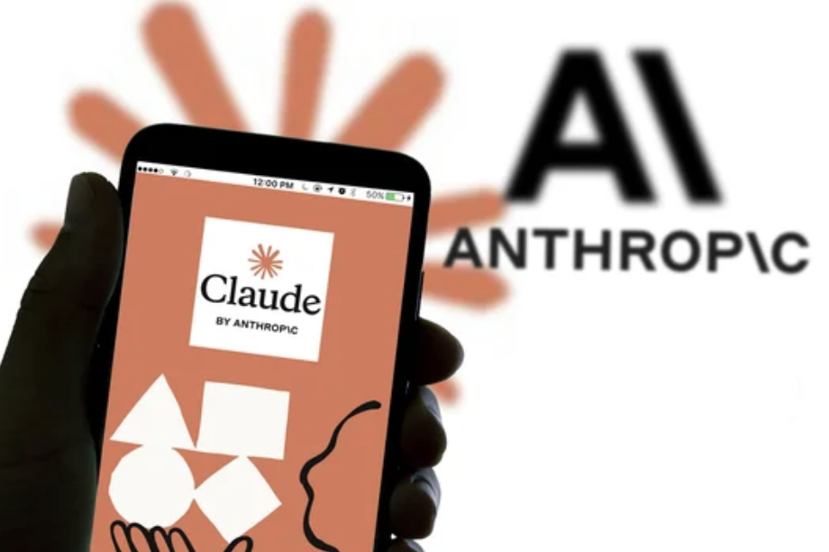 Hand holding a smartphone displaying the Claude by Anthropic app on an orange screen, with the AI Anthropic logo and an abstract orange background in view.
