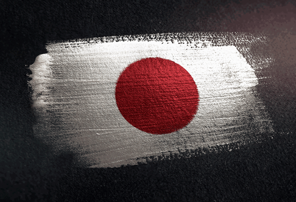 Red disc of the Japanese flag painted on a rough white brushstroke against a dark textured background.
