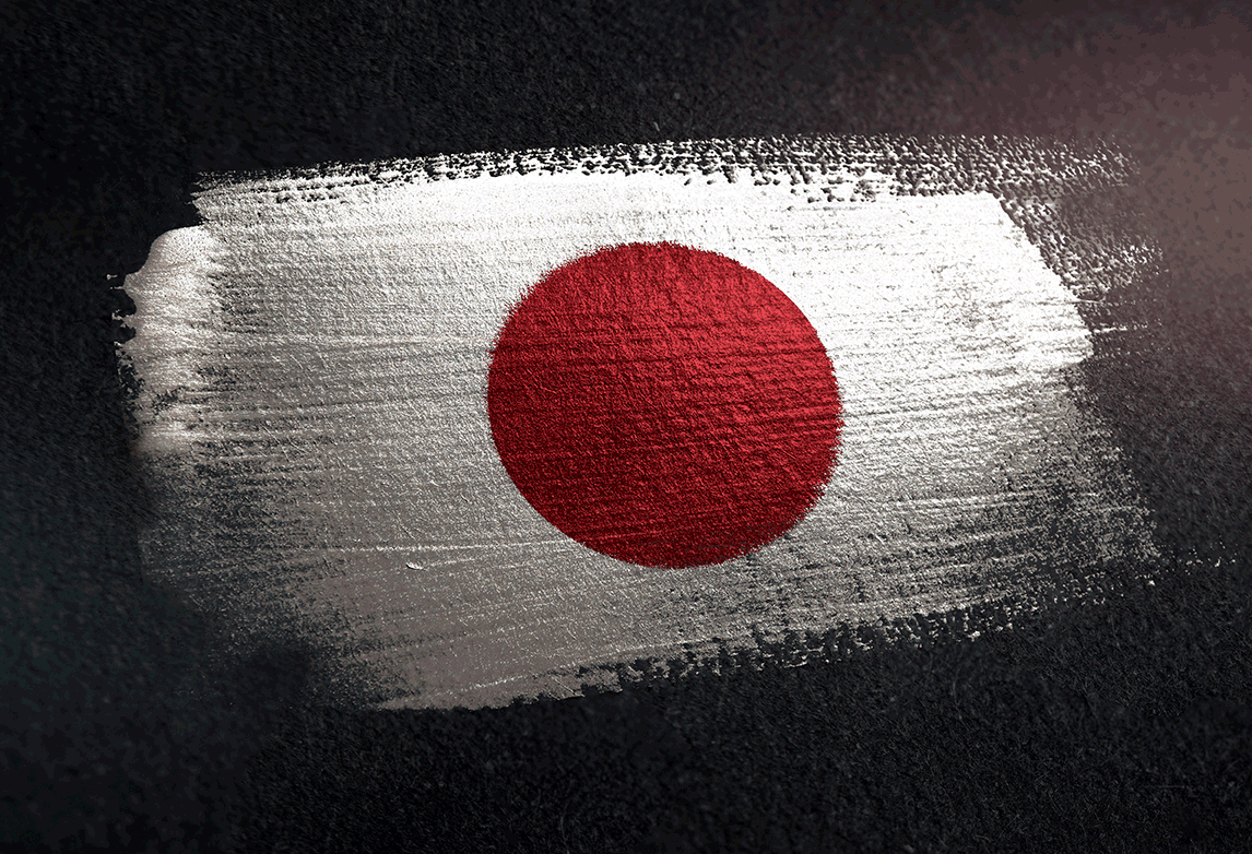 Red disc of the Japanese flag painted on a rough white brushstroke against a dark textured background.
